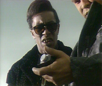 Grab from Backwards, with Lister holding a homing device